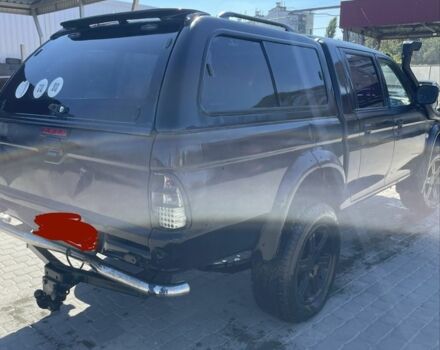 Черный Мицубиси Л 200, объемом двигателя 2.5 л и пробегом 220 тыс. км за 5299 $, фото 2 на Automoto.ua