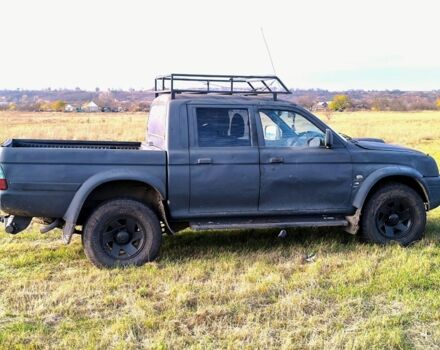 Черный Мицубиси Л 200, объемом двигателя 2.5 л и пробегом 200 тыс. км за 4000 $, фото 6 на Automoto.ua