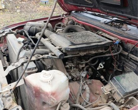 Черный Мицубиси Л 200, объемом двигателя 2.5 л и пробегом 500 тыс. км за 2611 $, фото 7 на Automoto.ua