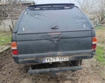 Черный Мицубиси Л 200, объемом двигателя 2.5 л и пробегом 500 тыс. км за 2611 $, фото 3 на Automoto.ua