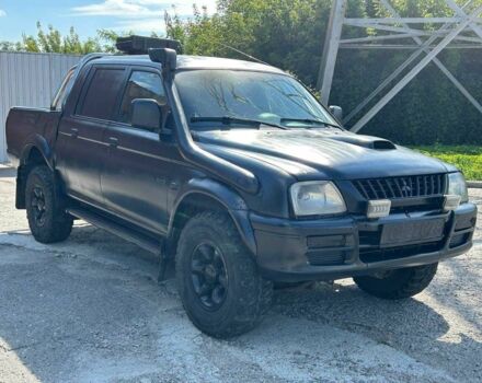 Чорний Міцубісі Л 200, об'ємом двигуна 2.5 л та пробігом 250 тис. км за 4800 $, фото 1 на Automoto.ua
