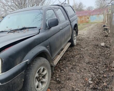 Черный Мицубиси Л 200, объемом двигателя 2.5 л и пробегом 500 тыс. км за 2611 $, фото 2 на Automoto.ua