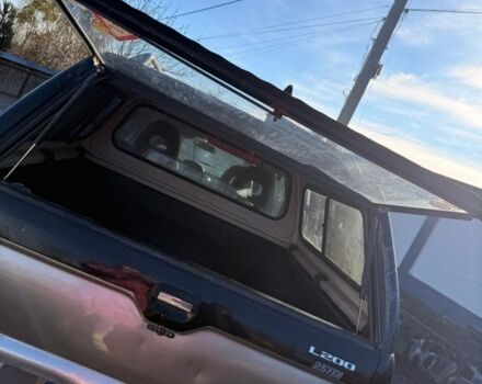 Черный Мицубиси Л 200, объемом двигателя 0 л и пробегом 225 тыс. км за 5205 $, фото 7 на Automoto.ua