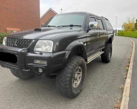 Черный Мицубиси Л 200, объемом двигателя 2.5 л и пробегом 150 тыс. км за 6500 $, фото 2 на Automoto.ua