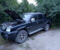 Черный Мицубиси Л 200, объемом двигателя 0 л и пробегом 150 тыс. км за 5000 $, фото 1 на Automoto.ua