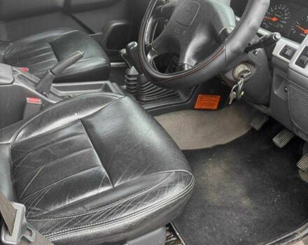 Черный Мицубиси Л 200, объемом двигателя 2.5 л и пробегом 150 тыс. км за 6500 $, фото 7 на Automoto.ua