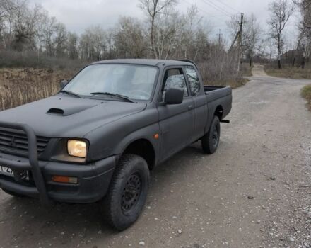 Черный Мицубиси Л 200, объемом двигателя 2.5 л и пробегом 220 тыс. км за 4500 $, фото 2 на Automoto.ua