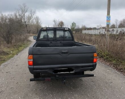 Черный Мицубиси Л 200, объемом двигателя 2.5 л и пробегом 220 тыс. км за 4500 $, фото 4 на Automoto.ua