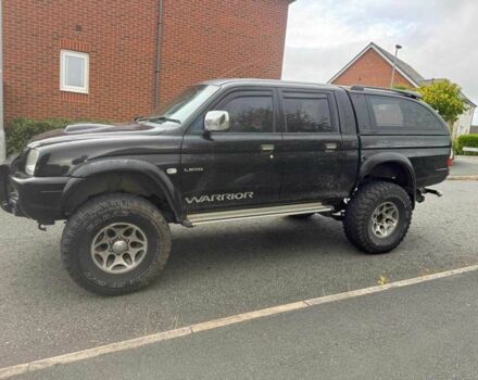 Черный Мицубиси Л 200, объемом двигателя 2.5 л и пробегом 150 тыс. км за 6500 $, фото 1 на Automoto.ua