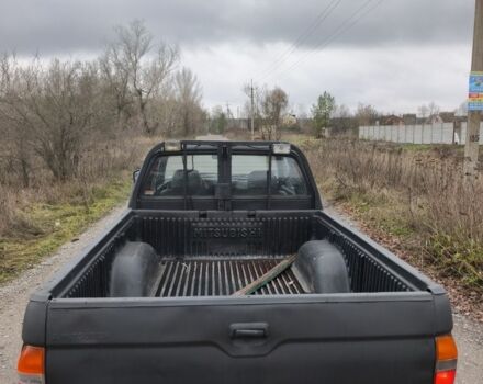 Черный Мицубиси Л 200, объемом двигателя 2.5 л и пробегом 220 тыс. км за 4500 $, фото 6 на Automoto.ua