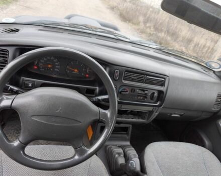 Черный Мицубиси Л 200, объемом двигателя 2.5 л и пробегом 220 тыс. км за 4500 $, фото 12 на Automoto.ua