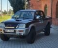 Черный Мицубиси Л 200, объемом двигателя 2.5 л и пробегом 190 тыс. км за 2100 $, фото 1 на Automoto.ua