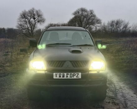 Черный Мицубиси Л 200, объемом двигателя 0 л и пробегом 232 тыс. км за 4100 $, фото 1 на Automoto.ua