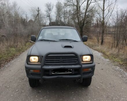 Черный Мицубиси Л 200, объемом двигателя 2.5 л и пробегом 220 тыс. км за 4500 $, фото 1 на Automoto.ua