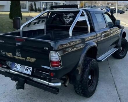 Мицубиси Л 200 2003 в Сумах на Automoto.ua Черный Мицубиси Л 200, объемом двигателя 2.5 л и пробегом 255 тыс. км за 2500 $, фото 2 на Automoto.ua