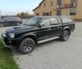 Черный Мицубиси Л 200, объемом двигателя 2.5 л и пробегом 300 тыс. км за 6901 $, фото 1 на Automoto.ua