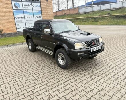 Чорний Міцубісі Л 200, об'ємом двигуна 2.5 л та пробігом 167 тис. км за 6647 $, фото 1 на Automoto.ua