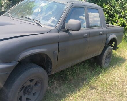 Черный Мицубиси Л 200, объемом двигателя 0 л и пробегом 530 тыс. км за 4100 $, фото 1 на Automoto.ua