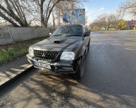 Черный Мицубиси Л 200, объемом двигателя 2.5 л и пробегом 270 тыс. км за 3500 $, фото 3 на Automoto.ua