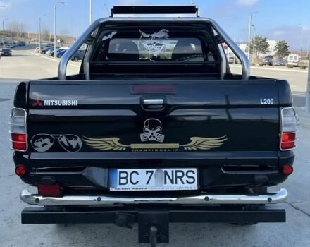 Мицубиси Л 200 2003 в Сумах на Automoto.ua Черный Мицубиси Л 200, объемом двигателя 2.5 л и пробегом 255 тыс. км за 2500 $, фото 1 на Automoto.ua