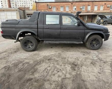 Мицубиси Л 200 2003 в Харькове на Automoto.ua Черный Мицубиси Л 200, объемом двигателя 3.2 л и пробегом 280 тыс. км за 3000 $, фото 1 на Automoto.ua