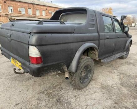 Мицубиси Л 200 2003 в Харькове на Automoto.ua Черный Мицубиси Л 200, объемом двигателя 3.2 л и пробегом 280 тыс. км за 3000 $, фото 2 на Automoto.ua
