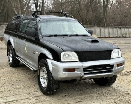 Черный Мицубиси Л 200, объемом двигателя 2.5 л и пробегом 355 тыс. км за 4500 $, фото 1 на Automoto.ua