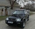 Черный Мицубиси Л 200, объемом двигателя 2.5 л и пробегом 250 тыс. км за 5100 $, фото 1 на Automoto.ua
