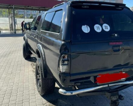 Черный Мицубиси Л 200, объемом двигателя 2.5 л и пробегом 225 тыс. км за 4450 $, фото 1 на Automoto.ua