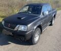 Черный Мицубиси Л 200, объемом двигателя 2.5 л и пробегом 250 тыс. км за 4000 $, фото 1 на Automoto.ua
