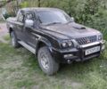 Черный Мицубиси Л 200, объемом двигателя 2.5 л и пробегом 150 тыс. км за 4800 $, фото 6 на Automoto.ua