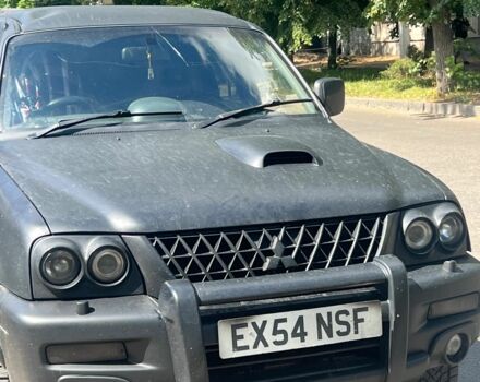 Чорний Міцубісі Л 200, об'ємом двигуна 2.5 л та пробігом 250 тис. км за 4500 $, фото 1 на Automoto.ua