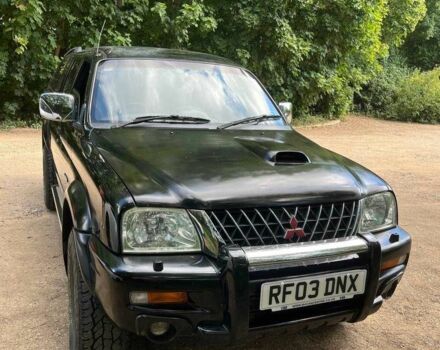 Черный Мицубиси Л 200, объемом двигателя 0 л и пробегом 150 тыс. км за 4667 $, фото 2 на Automoto.ua