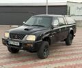 Черный Мицубиси Л 200, объемом двигателя 2.5 л и пробегом 200 тыс. км за 4250 $, фото 1 на Automoto.ua