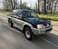 Черный Мицубиси Л 200, объемом двигателя 2.5 л и пробегом 128 тыс. км за 5832 $, фото 1 на Automoto.ua