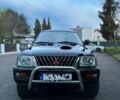 Чорний Міцубісі Л 200, об'ємом двигуна 2.5 л та пробігом 243 тис. км за 2110 $, фото 1 на Automoto.ua