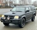 Черный Мицубиси Л 200, объемом двигателя 2.5 л и пробегом 250 тыс. км за 4250 $, фото 1 на Automoto.ua