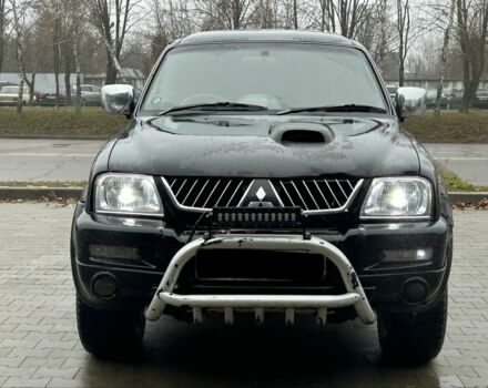 Черный Мицубиси Л 200, объемом двигателя 2.5 л и пробегом 170 тыс. км за 4250 $, фото 7 на Automoto.ua