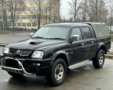 Черный Мицубиси Л 200, объемом двигателя 2.5 л и пробегом 170 тыс. км за 4250 $, фото 6 на Automoto.ua