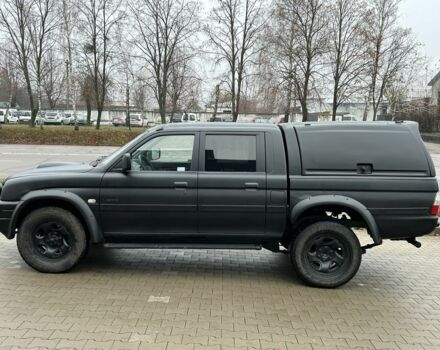 Черный Мицубиси Л 200, объемом двигателя 2.5 л и пробегом 250 тыс. км за 4250 $, фото 1 на Automoto.ua