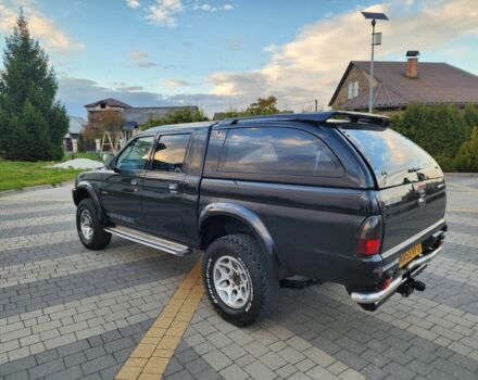 Черный Мицубиси Л 200, объемом двигателя 2.5 л и пробегом 156 тыс. км за 7521 $, фото 6 на Automoto.ua