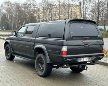 Черный Мицубиси Л 200, объемом двигателя 2.5 л и пробегом 250 тыс. км за 4250 $, фото 2 на Automoto.ua