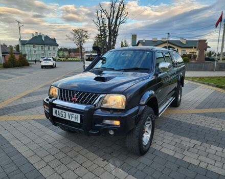 Черный Мицубиси Л 200, объемом двигателя 2.5 л и пробегом 156 тыс. км за 7521 $, фото 4 на Automoto.ua