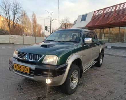 Черный Мицубиси Л 200, объемом двигателя 2.5 л и пробегом 300 тыс. км за 5100 $, фото 1 на Automoto.ua