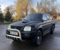 Черный Мицубиси Л 200, объемом двигателя 2.5 л и пробегом 250 тыс. км за 5300 $, фото 1 на Automoto.ua