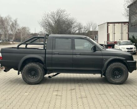 Чорний Міцубісі Л 200, об'ємом двигуна 2.5 л та пробігом 150 тис. км за 4250 $, фото 1 на Automoto.ua