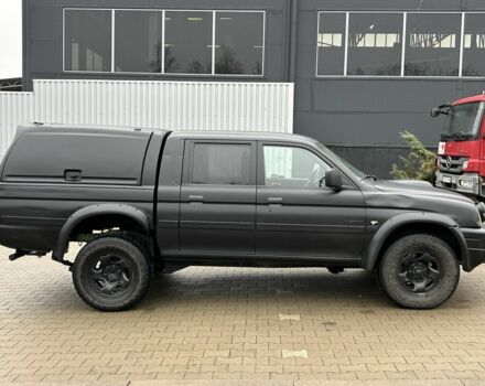 Черный Мицубиси Л 200, объемом двигателя 2.5 л и пробегом 250 тыс. км за 4250 $, фото 5 на Automoto.ua