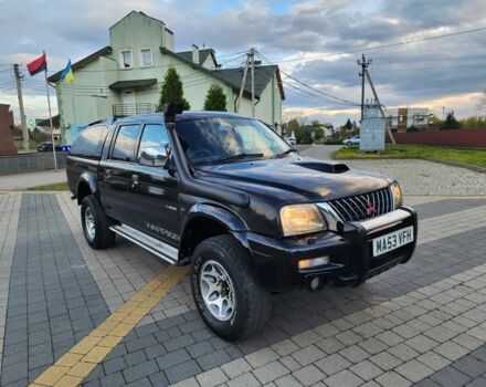 Черный Мицубиси Л 200, объемом двигателя 2.5 л и пробегом 156 тыс. км за 7521 $, фото 2 на Automoto.ua