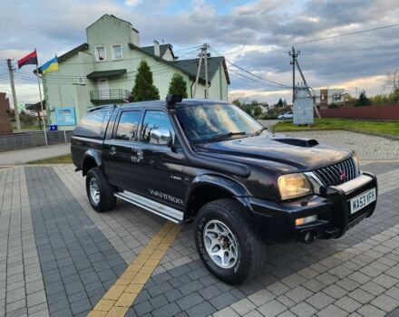 Черный Мицубиси Л 200, объемом двигателя 2.5 л и пробегом 156 тыс. км за 7521 $, фото 1 на Automoto.ua
