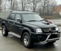 Черный Мицубиси Л 200, объемом двигателя 2.5 л и пробегом 170 тыс. км за 4250 $, фото 1 на Automoto.ua